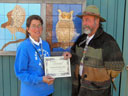 Randy Sinclair presents FoGR's first 'Eco-Hero' award to Cindy Gonzales, principal of Manchester School