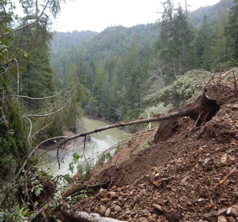 Landslide extending below Stewarts Point-Skaggs Springs Road to the Gualala River Wheatfield Fork. Unconsolidated shale and subsoil slope to the river’s south bank at the downstream end of the landslide, west of Soda Springs site (USGS map place-name). March 3, 2019.